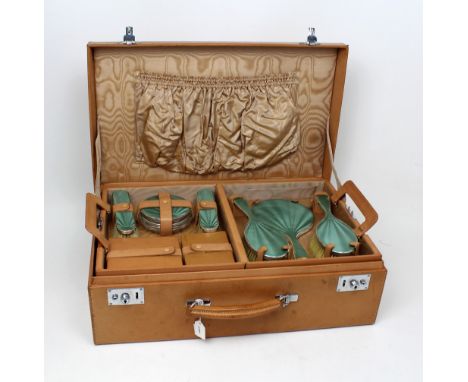 A George VI hallmarked silver and engine-turned pale green enamel decorated six-piece travel vanity set comprising two hairbr