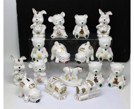 A small collection of ceramic money boxes, some in the form of pigs.