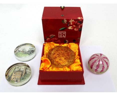 A small group of glass paperweights to include a boxed Liuligongfang amber glass example with manufacturing marks to base and