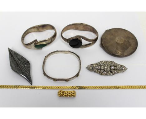 A mixed lot comprising engine-turned silver compact, Birmingham 1946, three various bangles, an Art Deco marcasite brooch, an