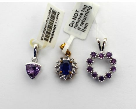 A 9ct white gold pendant set with white topaz, trilliant concave-shaped amethyst, a further 9ct white gold heart pendant set 