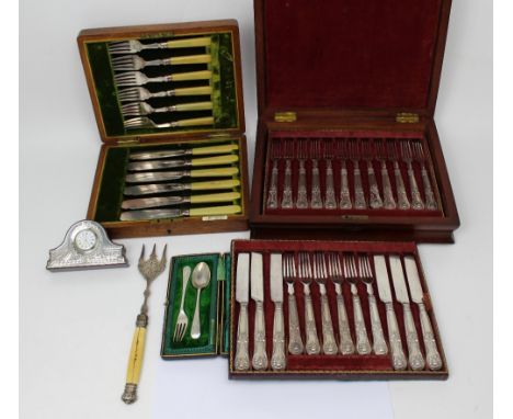An oak-cased set of twelve knives and forks with silver collars, a walnut case of thirty-six knives and forks with silver col