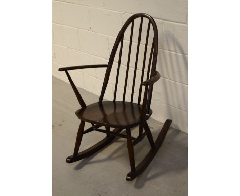 An Ercol rocking chair of small proportions.