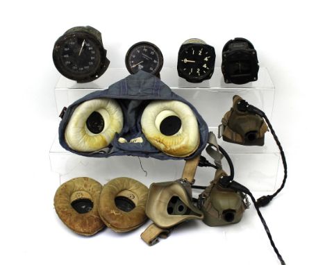 A WWII period RAF G-Type flying helmet (size 2), .48225/58 with War Issue mark, three contemporary oxygen masks, all with War