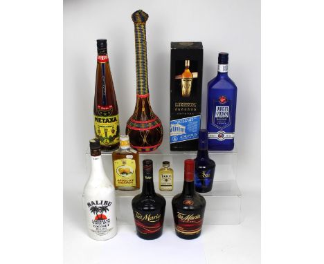 Two bottles of 700ml Tia Maria, a 1L bottle of Malibu rum a 1L of Virgin Vodka, a boxed 1L bottle of Metaxa and an unboxed ex