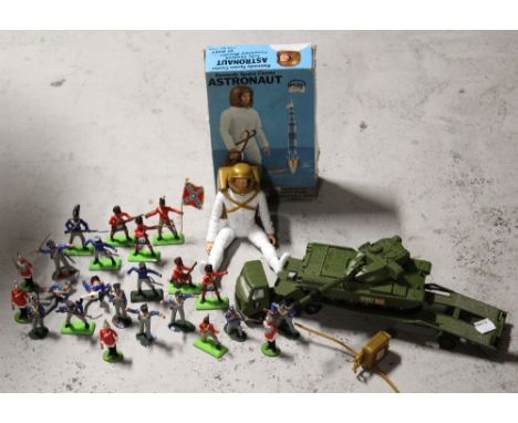 A boxed Marx 'Kennedy Space Center' astronaut, also a souvenir space emblem, a quantity of Britains toy soldiers, Dinky tank 
