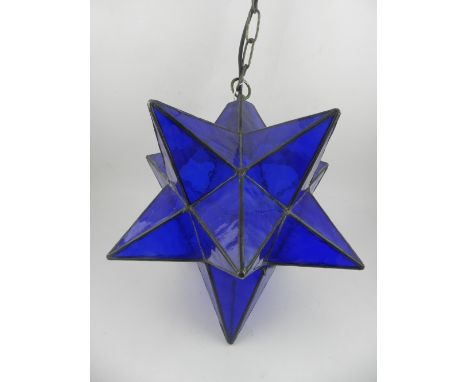 A ceiling light fashioned as a star.