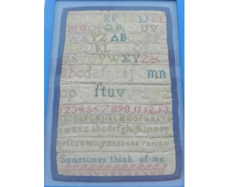 A 19th century needlework sampler, with numerical, alphabet and verse decoration. H.15cm W.9cm