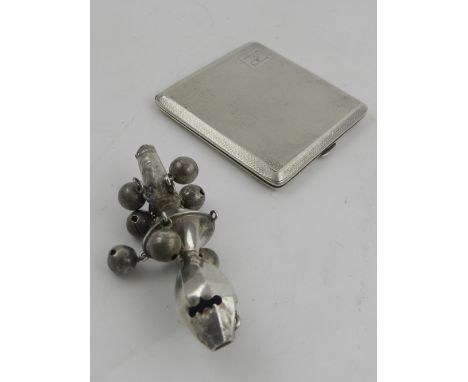 A Continental white metal babies rattle whistle, lacking coral terminal, together with a 1930's silver and silver gilt engine