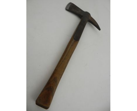 An early 20th century fireman's axe, engraved indistinctly to blade. L40cm