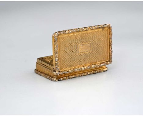 A Victorian silver gilt vinaigrette, of rectangular form, with foliate scroll border, decorated with engine turning, the hing