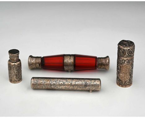 A Victorian silver double-ended scent or perfume bottle, of cylindrical form, the exterior profusely decorated with flowers a