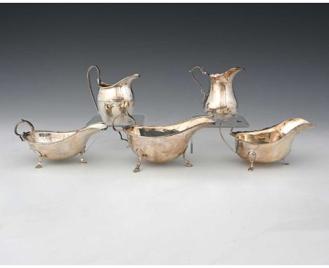 A late Victorian silver cream jug, in the eighteenth-century manner, Hukin &amp; Heath, London 1897, height 10cm, together wi