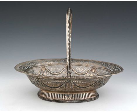 A George III silver neoclassical cake or bread basket, of oval form, the body reticulated and pierced with flowerheads, folia