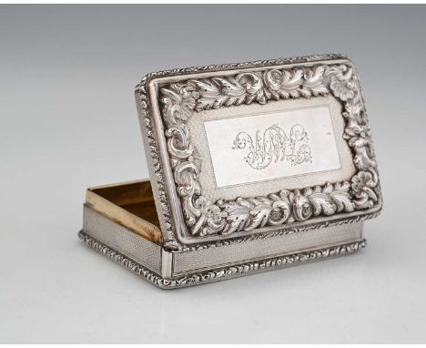 A Victorian silver presentation table snuff box, of rectangular form, with cast floral and scroll rim, the hinged cover with 