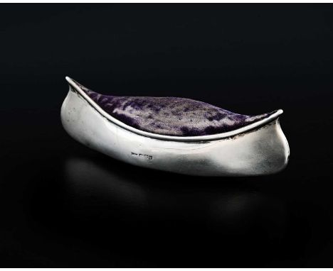 An Edwardian silver novelty pin cushion, modelled in the form of a canoe, of large size, Saunders &amp; Shepherd, Chester 190
