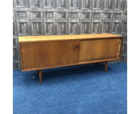 DANISH TEAK SIDEBOARD IN THE MANNER OF J.L. MOLLER, with two sliding panel doors enclosing shelving, on tapering spindle legs