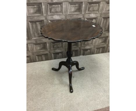 MAHOGANY CIRCULAR TIP-UP TEA TABLE, of George III design, the top with pie crust border, on a tapering and spiral moulded vas