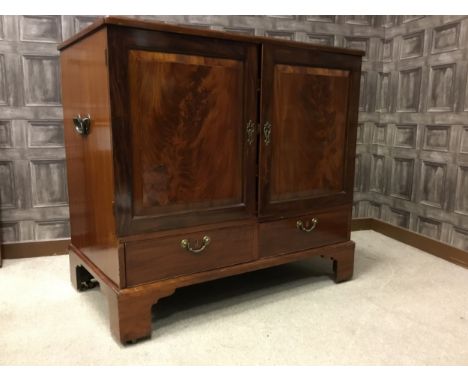 MAHOGANY DWARF PRESS CUPBOARD, of Chippendale design, the crossbanded top with a series of pull out slides below, enclosed by