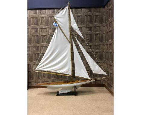 SCALE MODEL YACHT 'SNOW GOOSE', the white painted body inscribed ‘Snow Goose’, fabric sails, approximately 195cm long, on sta