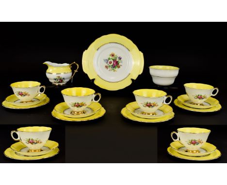 Regency Bone China Part Tea Set. Comprising six cups, saucers and side plates, sugar bowl and milk jug. Bright yellow decorat