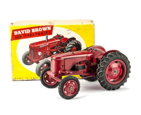 An uncommon Denzil Skinner David Brown 25D Tractor, in red, in original box, F, lacks one side bonnet cover, some damage and 