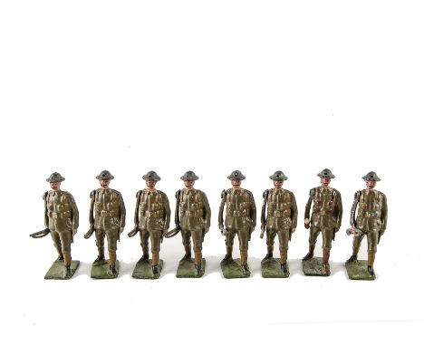 Britains unboxed set 195 British Infantry marching at the trail in shrapnel proof helmets, 1930s version, with officer, grey 