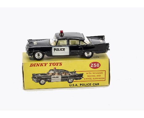 A Dinky Toys 258 USA Police Car, De Soto casting, black body, white front doors, red roof light, in original box, VG, lacks a