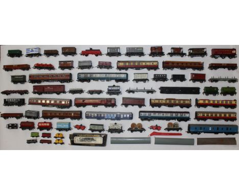 Model Railway: A collection of assorted OO Gauge model railway rolling stock and coaches, some in need of attention, together