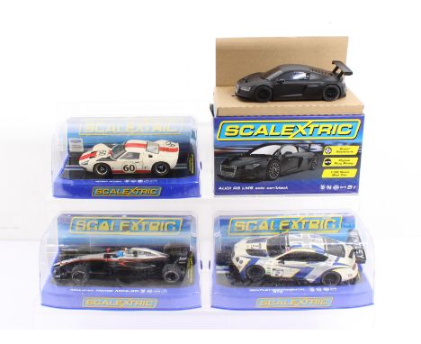 Scalextric: A collection of four boxed Scalextric slot car vehicles to comprise: Ford GT40, Bentley Continental GT3, McLaren 