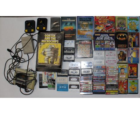 Commodore 64: An unboxed Commodore 64 console, together with a collection of cased and uncased tapes and games. Untested for 
