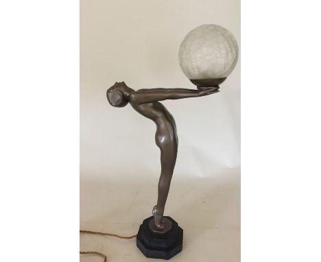 ART DECO STYLE LAMP. A lamp cast in resin in classic Art Deco style, circa 1960/70s. Measures approx 60cm. Repair to glass. U