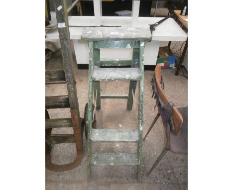 pair of wooden step ladders