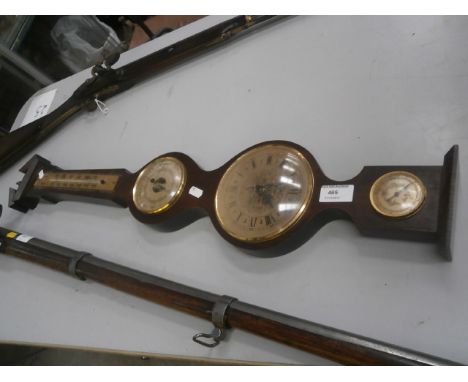 wood and brass barometer