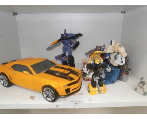 shelf of collectable transformer toys