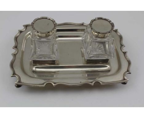 WILLIAM HUTTON &amp; SONS LTD, A GEORGIAN DESIGN SILVER STANDISH (inkwell stand), the shaped edge base with two pen trays, on
