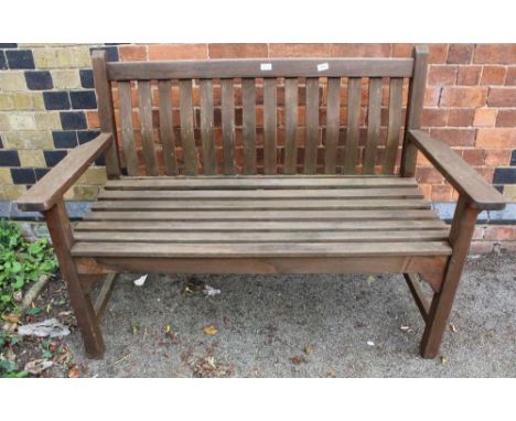 A TEAK SLAT BUILT TWO PERSON GARDEN BENCH 