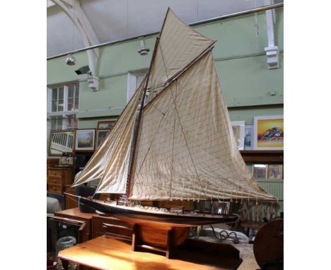A LATE 20TH CENTURY 'AUTHENTIC MODELS' YACHT, of wooden construction, fully rigged with sails, brass fittings, includes ships