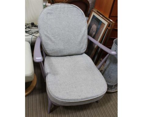 A LATER PAINTED ERCOL DEEP SEATED ARMCHAIR with fleur-de-lis back 