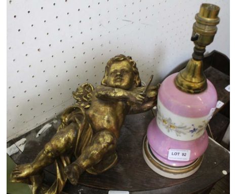 A PINK LUSTRE BASE TABLE LAMP together with a violin playing cherub wall hanging 