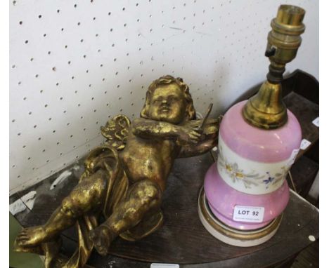 A PINK LUSTRE BASE TABLE LAMP together with a violin playing cherub wall hanging 