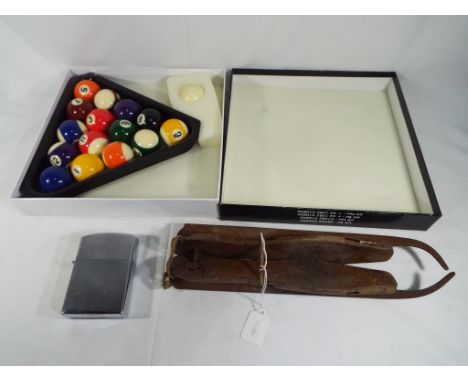 A pair of vintage ice skates, a set of Riley pool balls and triangle in box and a large novelty Zippo style lighter approx 11