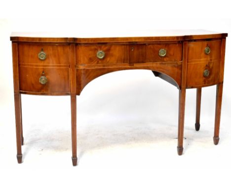 A George III mahogany bow-fronted sideboard with central drawer flanked by two deep drawers, one with a compartmentalised bas