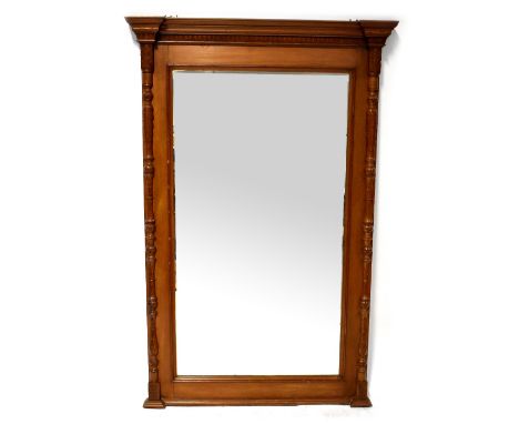An Indonesian hardwood pier mirror with rectangular mirror plate within a carved frieze and applied uprights, 169 x 110cm. CO