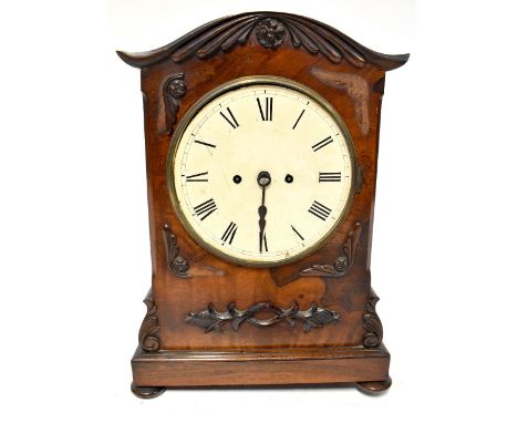 An early 19th century mahogany-cased bracket clock, the painted dial set with Roman numerals, fusee movement, arched case wit