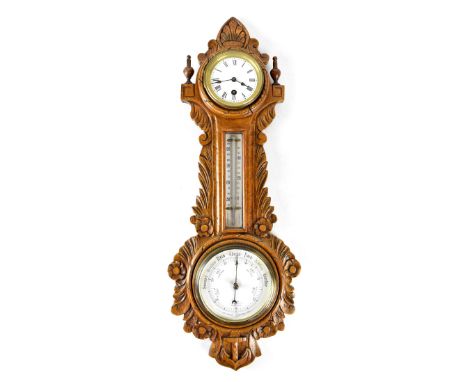 An early/mid-20th century oak banjo barometer/weather station, clock to base the white dial set with Roman numerals, central 
