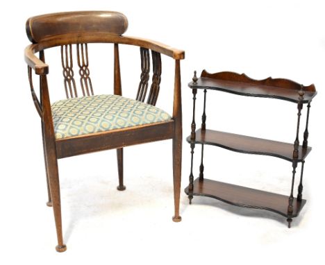 An Edwardian inlaid mahogany open elbow chair with pierced splats and drop-in seat, on turned tapering legs with squat feet a