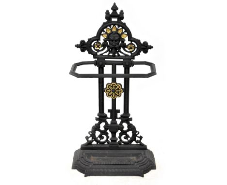 A painted and gilt-heightened cast iron stick stand with Green Man motif and drop-in drip tray, height 82cm. CONDITION REPORT