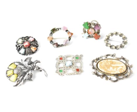 Four various Scottish-style brooches, a similar ring and two further brooches (7).