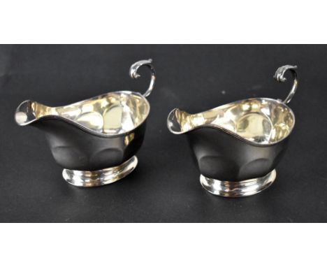 A pair of George V hallmarked silver sauce boats, Edinburgh 1928, Hamilton & Inches, combined approx 8ozt (2). CONDITION REPO